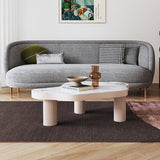 Table basse moderne en pierre frittée blanche avec trois pieds et design à motif ondulé