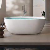 A modern freestanding bathtub in a serene setting with a minimalistic design.