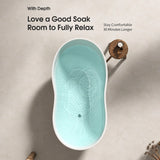 A modern bathtub displayed in a bright and minimalistic bathroom setting.