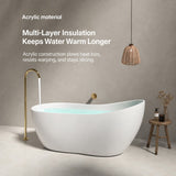 A modern acrylic bathtub in a stylish setting with a dangling light fixture.