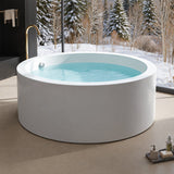 A modern, round bathtub filled with water, displayed in a stylish bathroom setting.