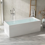 A modern white bathtub with water, set in a stylish, bright room.