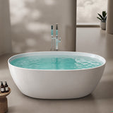 A modern freestanding bathtub with water and a plant in a stylish interior setting.