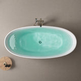 A modern, oval-shaped bathtub with light blue water, set against a neutral backdrop.