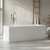 A modern white bathtub staged in a minimalist bathroom setting with a ladder and decorative elements.