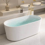 A modern freestanding bathtub with water in a stylish bathroom setting.