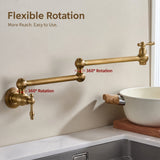 A brass pot filler faucet mounted on a wall above a kitchen sink, with articulated arms, shown near a white bowl and wooden board.