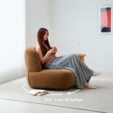 Woman seated in a brown chenille swivel barrel chair on a rug, with a 360° rotation arrow
