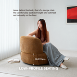 Woman seated in a brown upholstered swivel barrel chair with a 13.8"/35cm seat height marker in a bright room