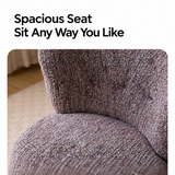 Close-up of a mottled lilac-gray swivel barrel chair seat and curved backrest, cream rug behind
