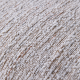 Macro close-up of loop yarn upholstery with raised cream loops over a mottled brown-gray weave