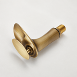 Brushed brass faucet spout, angled side view on white showing flat handle and threaded inlet