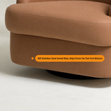 Close-up of a tan swivel barrel chair's curved armrest edge and dark round base on a light studio floor.