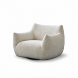 Off-white textured curly fleece barrel chair with cat-ear backrest on white studio background