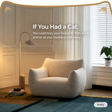 Ivory bouclé swivel barrel chair with cat-ear backrest in a warm paneled room, a curved floor lamp and plant nearby