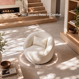 Cream bouclé swivel barrel chair with pillow, 360° arrow graphic on sunlit floor