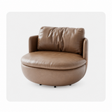 Light brown leather-look swivel barrel chair front view on a white studio backdrop