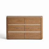 Six-drawer walnut sideboard viewed straight on against a white studio background, wide top overhanging rounded side posts