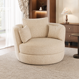 Cream woven swivel barrel chair with cushioned back and two throw pillows on a shaggy rug near a wood cabinet