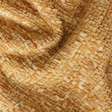 Close-up of soft tan chenille upholstery fabric with a textured woven pile