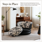 Cushion lifted off a black swivel barrel chair with woodland-print fabric in a furnished room
