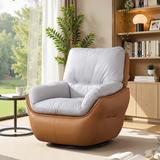 Tan leather-look swivel barrel chair with gray cushions beside a window and wooden shelving