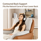 Woman with headphones reclining against the contoured gray back cushion of a tan leather-look swivel chair in a cream room