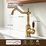 Antique copper kitchen faucet with wood-grain handle and curved spout, on a light marble countertop.