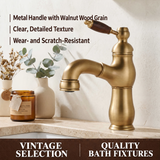 Antique brass kitchen faucet with a walnut wood-grain lever handle on a beige stone countertop.