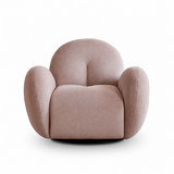 White-background studio shot of a dusty pink velvet swivel barrel chair with rounded back and black base.