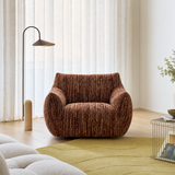 Rust-brown textured swivel barrel chair on chartreuse rug by sheer curtains and arc lamp