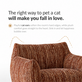 Close-up of a rust-brown ribbed swivel barrel chair's cat-ear backrest and curved armrests, white studio backdrop