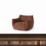 Rust-brown textured swivel barrel chair with cat-ear backrest on white studio background