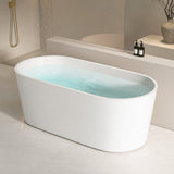A modern white bathtub with water, set in a contemporary bathroom environment