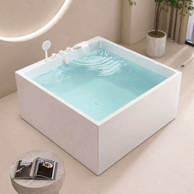 A modern square bathtub in a stylish bathroom setting with natural light.