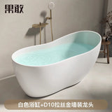 A modern white bathtub with a sleek design and a gold faucet displayed in a minimalist bathroom setting.