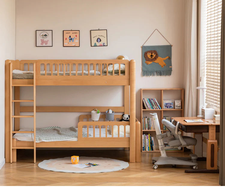 Beech solid wood children's bunk bed in a light room with a round rug, bookshelf, and desk in a cozy corner