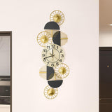 Horloge murale géométrique de luxe noir et or