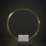 Lámpara de mesa circular LED posmoderna en dorado con base de mármol blanco