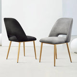 Juego de 2 sillas de comedor modernas tapizadas en gris con respaldo hueco y patas doradas